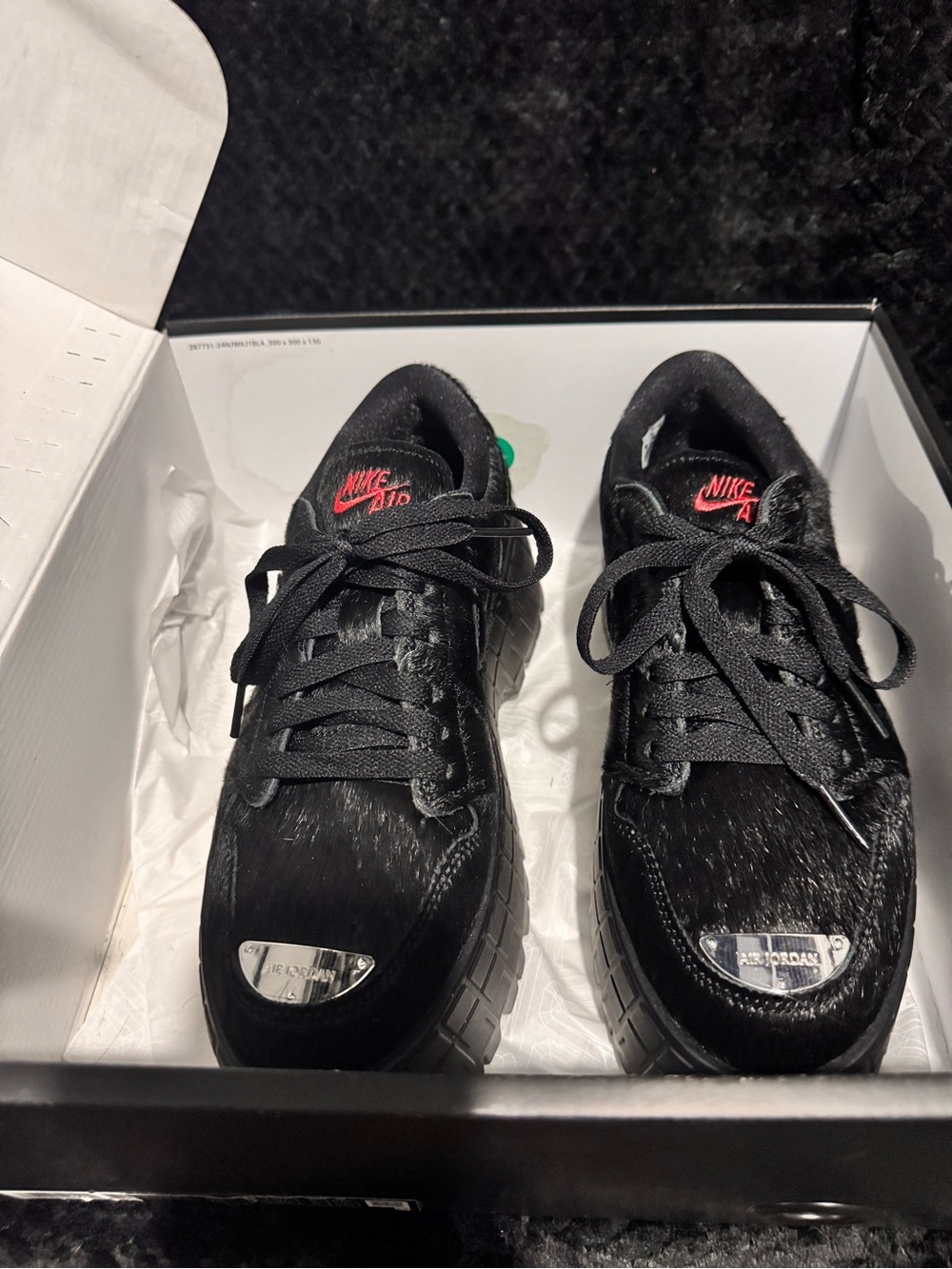 Nike Black Pony Hair Low-Top Sneakers with Red Logo Accents